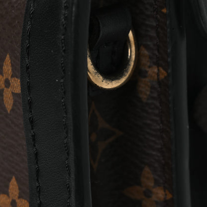 Reverse Monogram Trunk Clutch